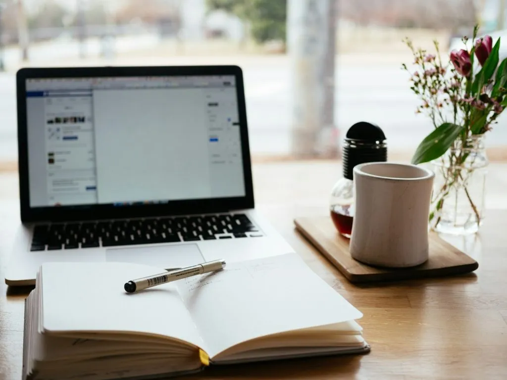 How Digital Publishing Empowers Authors: An Overview 2 MacBook Pro near white open book